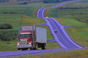 Overweight and overloaded trucks on the highway can be a danger.